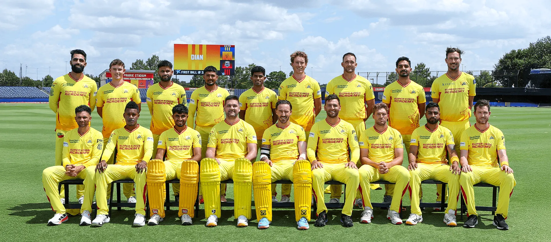 The Texas Super Kings squad posing in yellow jerseys